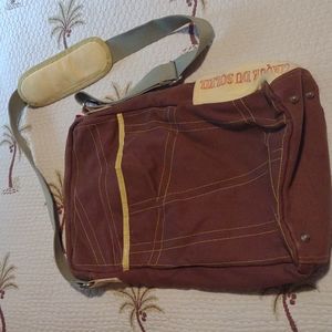 Cirque du Soleil brown and yellow messenger crossbody bag.